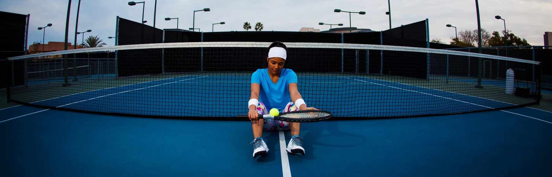 Group of people playing outdoor sports together as part of corporate team building activity